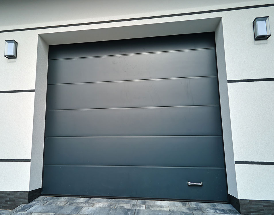 A closed, evenly painted garage door that ties in with modern tiled flooring.