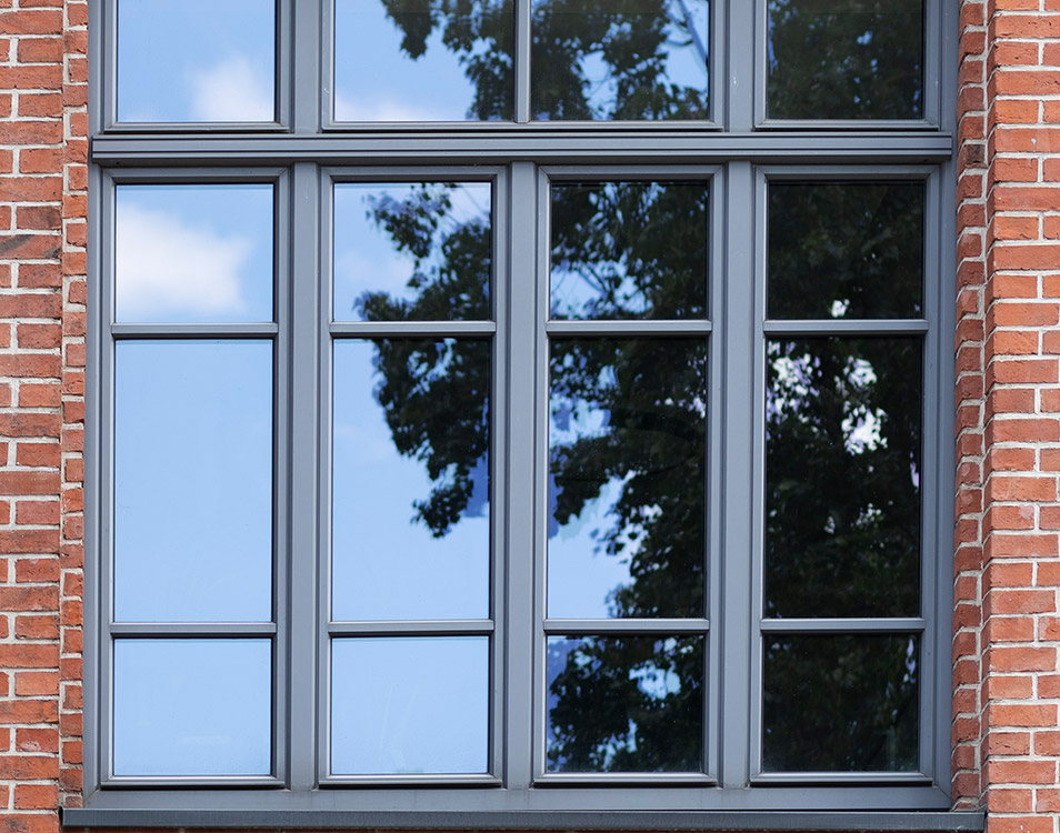 A newly painted window frame in dark grey with an expert finish giving a modern look.